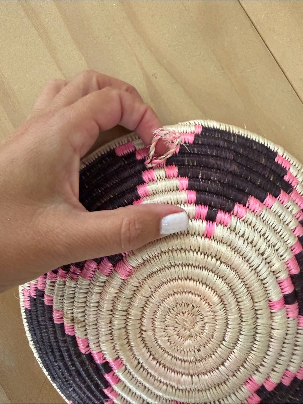African Handwoven Decorative Basket tray in Black, cream, & bright Pink. - Picture 4 of 5
